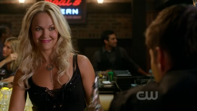 At the bar, Dean talks with the pretty bartender Mia. 